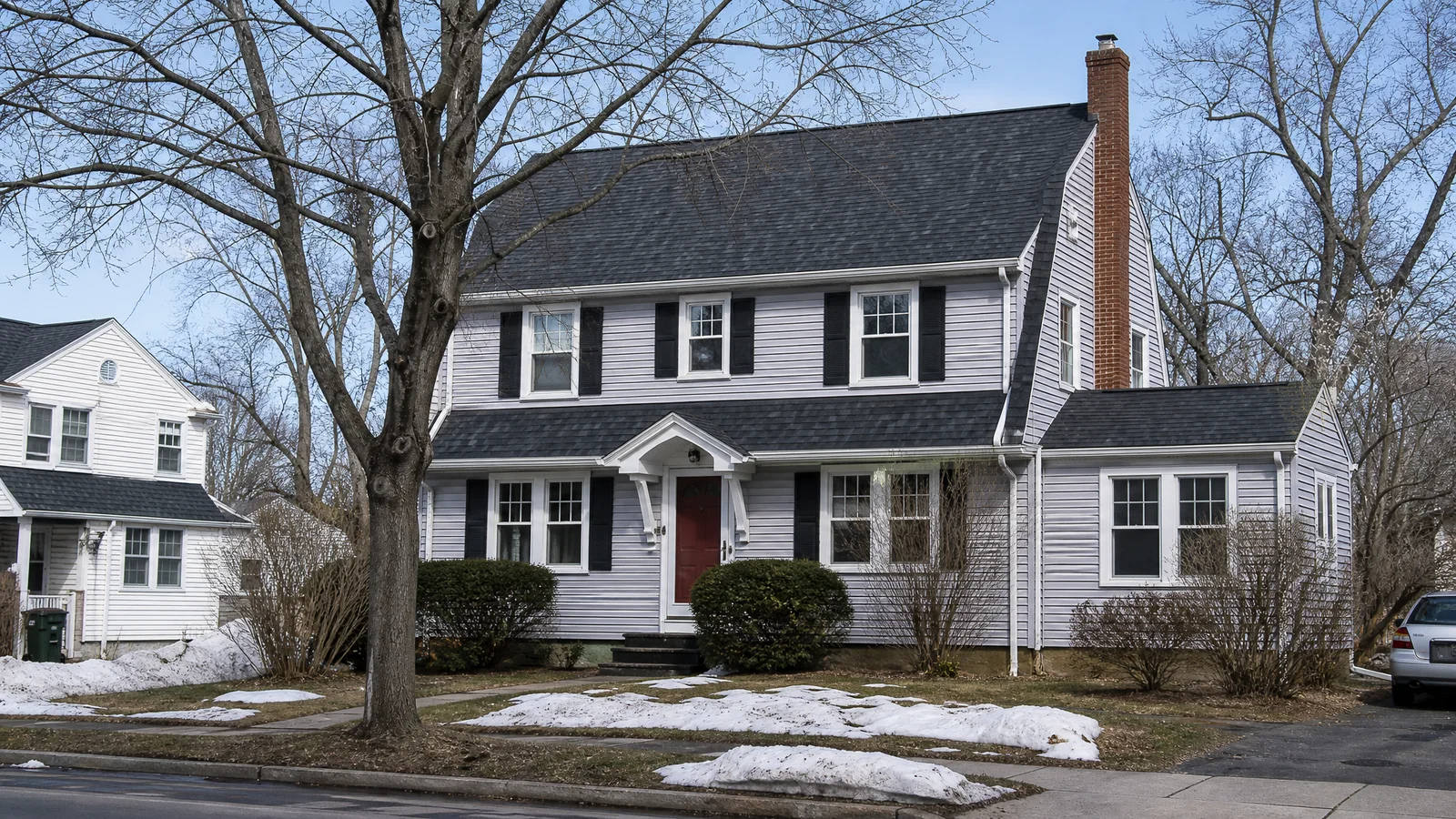 Completed roof replacement on a Wethersfield colonial after winter storm damage
