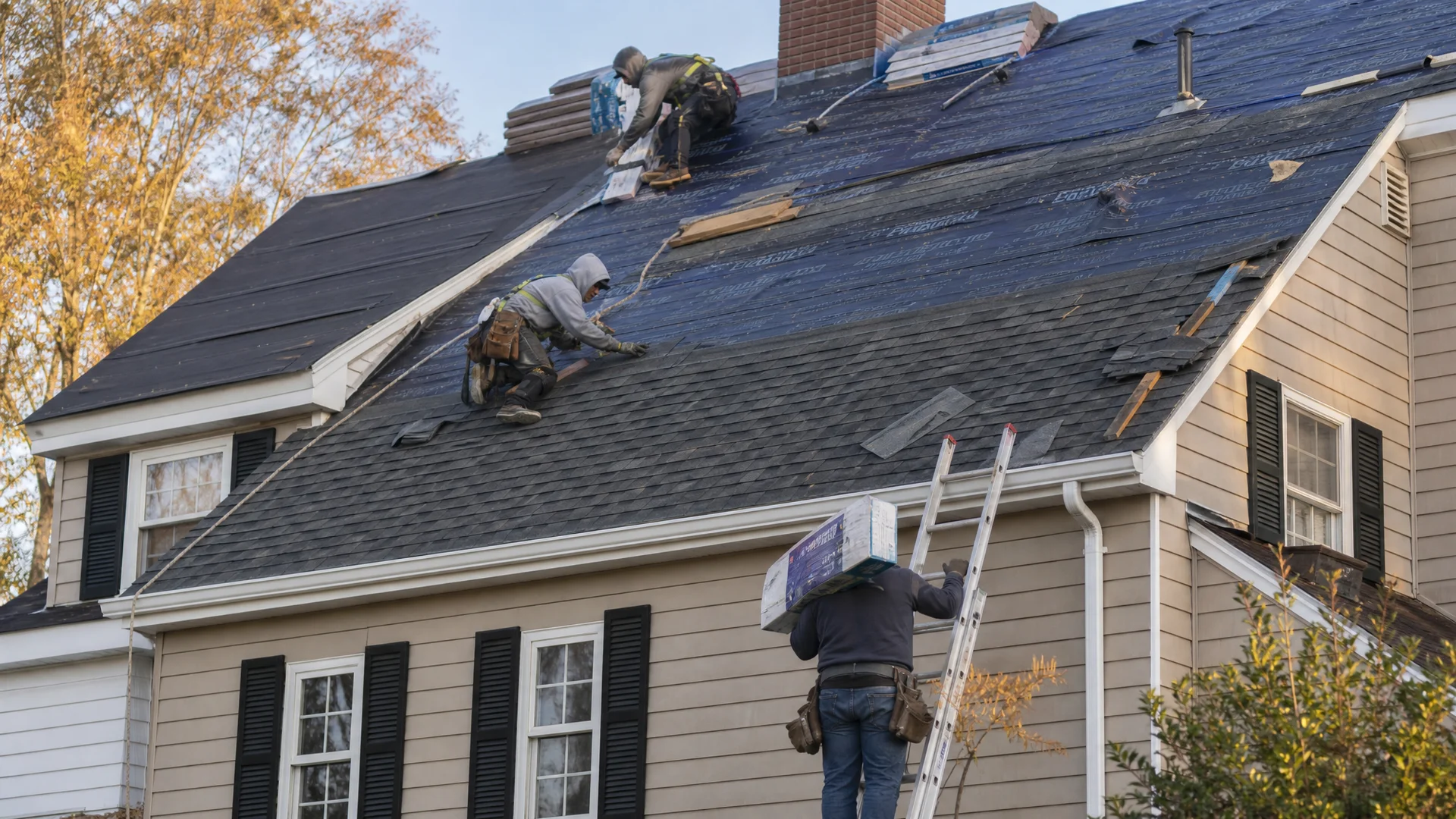 Professional roofing crew installing a new roof in Newington CT