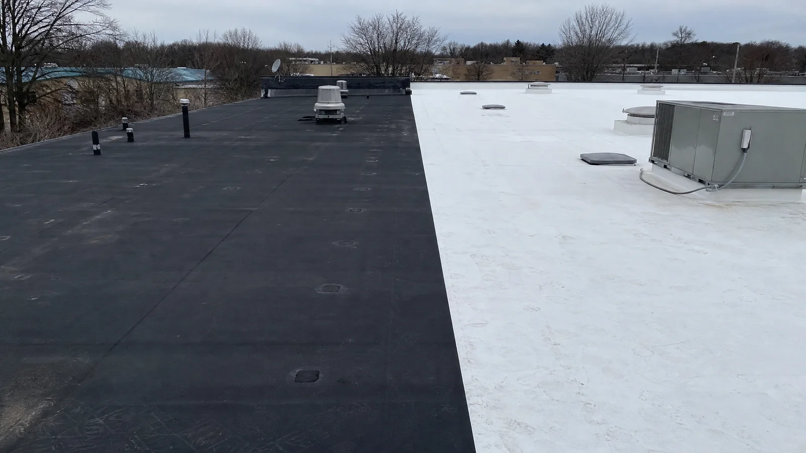 EPDM and TPO flat roof surfaces side by side